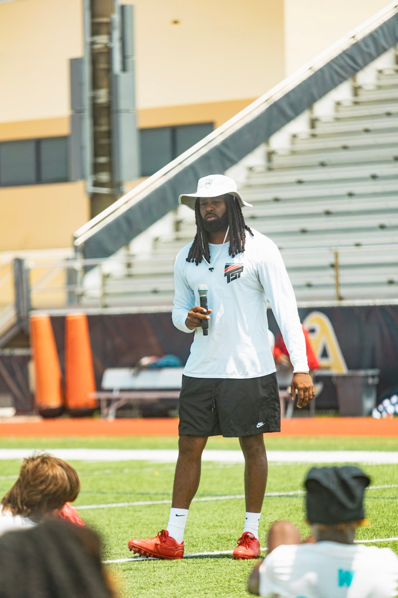 Top Shelf TJ coaching young athletes at the WeTrain camp