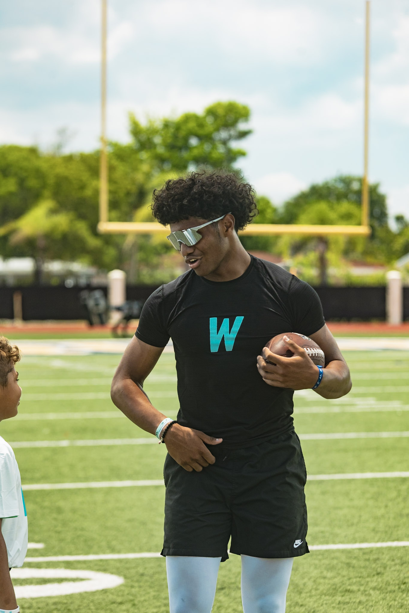 Trainer mentoring a young camper one-on-one