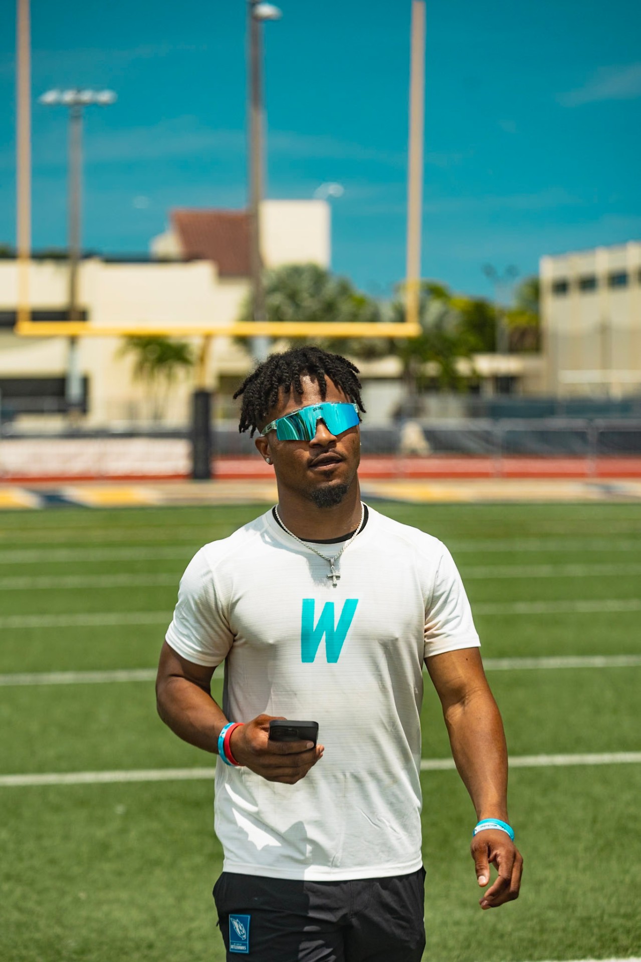Jahcour Pearson running reps with campers at the WeTrain youth camp