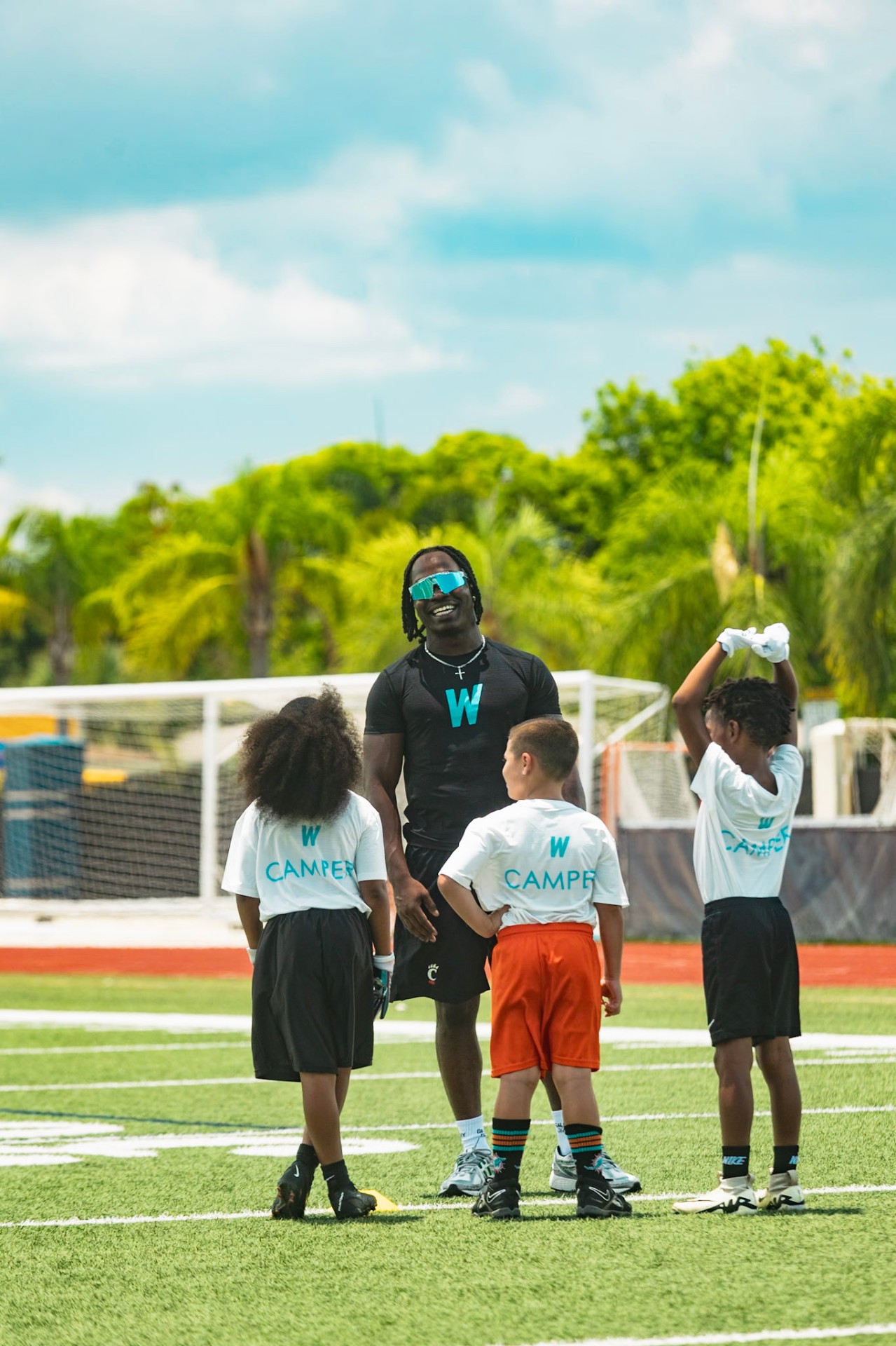 Aaron Turner running drills with young athletes at the WeTrain camp